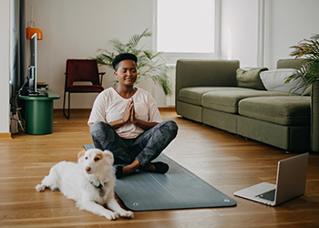 woman doing yoga at home