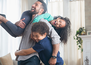 dad playing with his two children