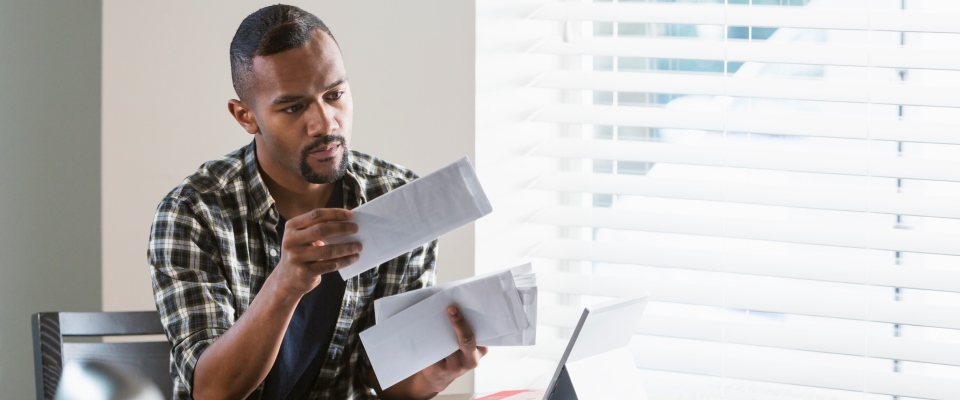 man looking at mail