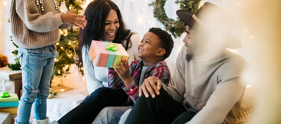 family exchanging presents a family exchanging Christmas presents
