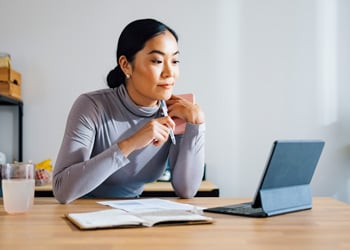 woman looking at her laptop