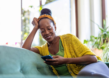 woman looking at mobile phone