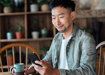 man looking at phone