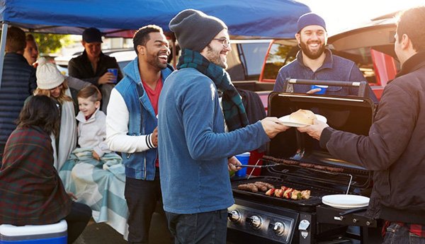 friends tailgating before a game