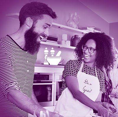 man and woman cooking together