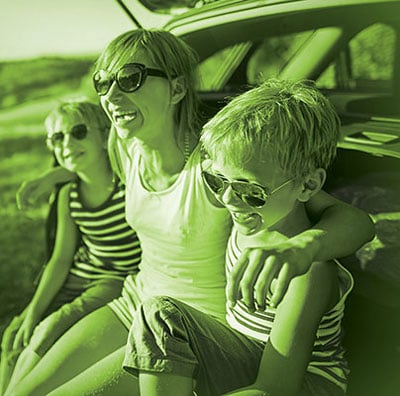 Family sitting in car