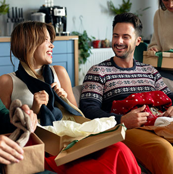 friends opening christmas presents