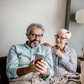 Couple looking at mobile phone