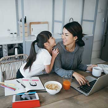 mom and daughter at computer