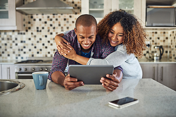 couple reading tablet together